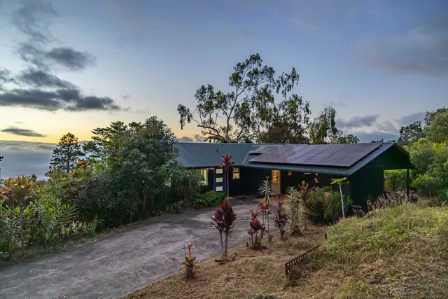 a view of a table and chairs under an umbrella