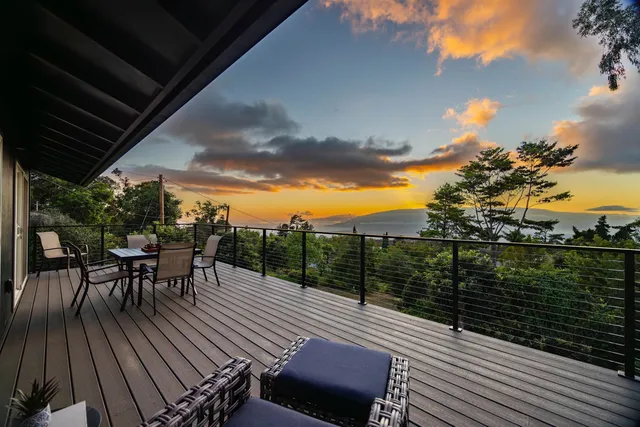 a view of a balcony with furniture