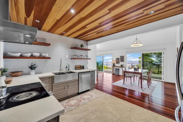a kitchen with furniture and wooden floors