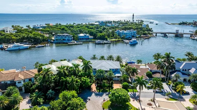 an aerial view of a house with a lake view