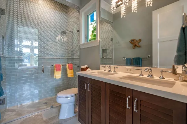 a living room with furniture a wooden floor and a large window