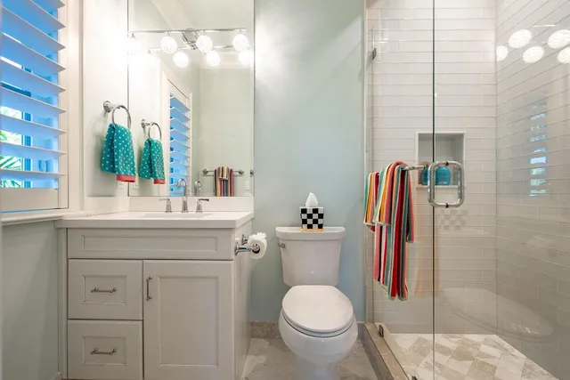 a view of a house with pool and chairs
