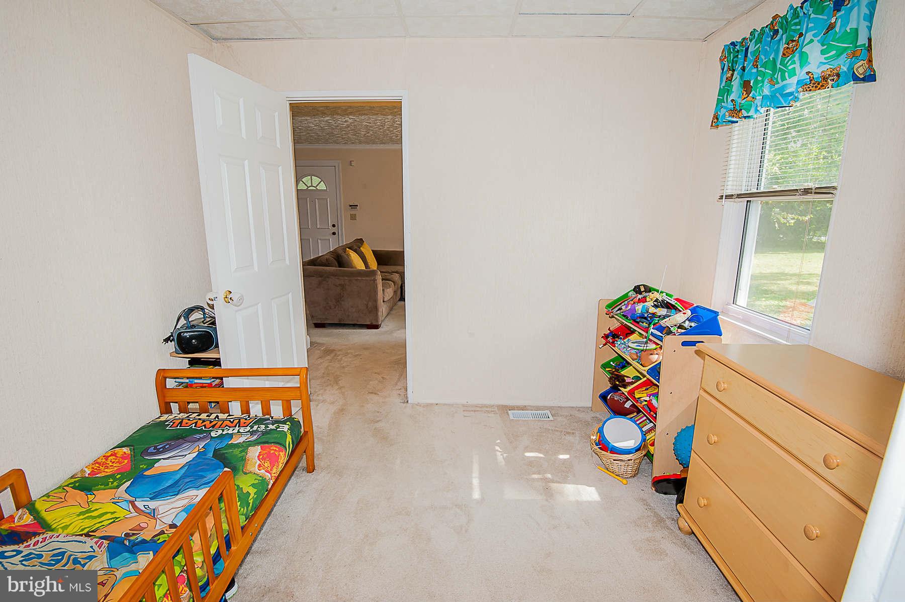 3602 Landbeck Road Baltimore, MD 21207 - Photo 14 of 30 a kids room with toys and a window
