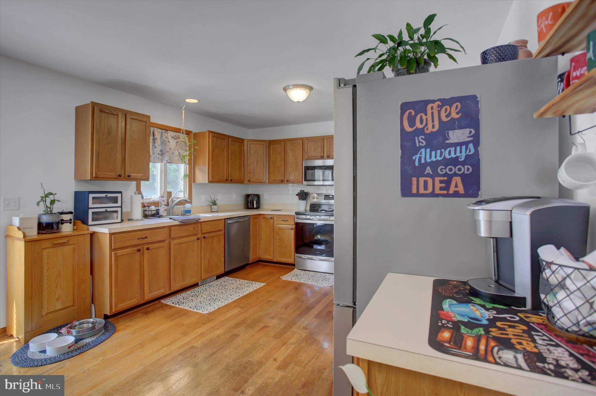 10482 Mapleton Road Shippensburg, PA 17257 - Photo 12 of 40 a kitchen with a refrigerator and a stove top oven