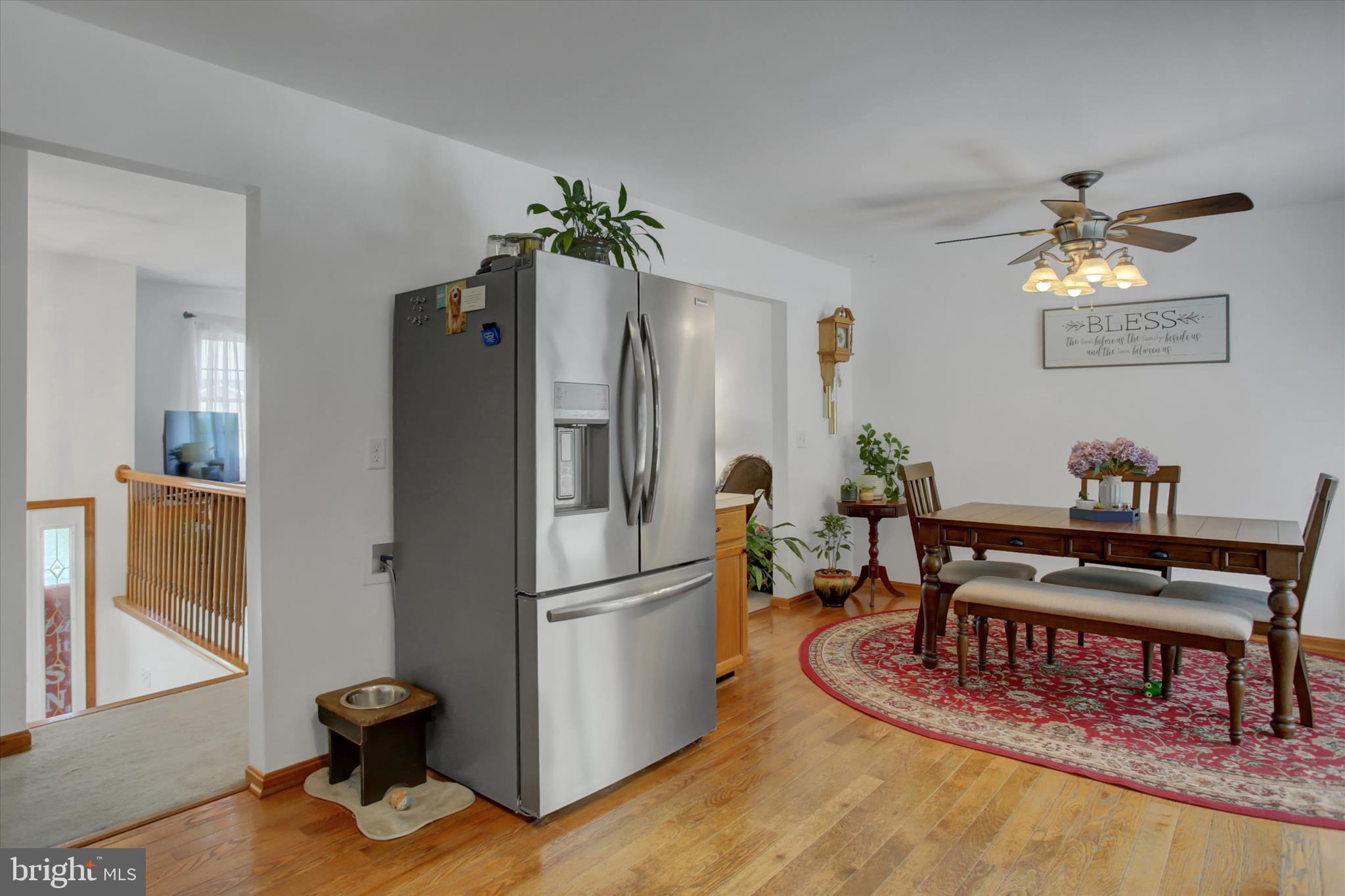 10482 Mapleton Road Shippensburg, PA 17257 - Photo 15 of 40 a kitchen with stainless steel appliances refrigerator dining table and chairs