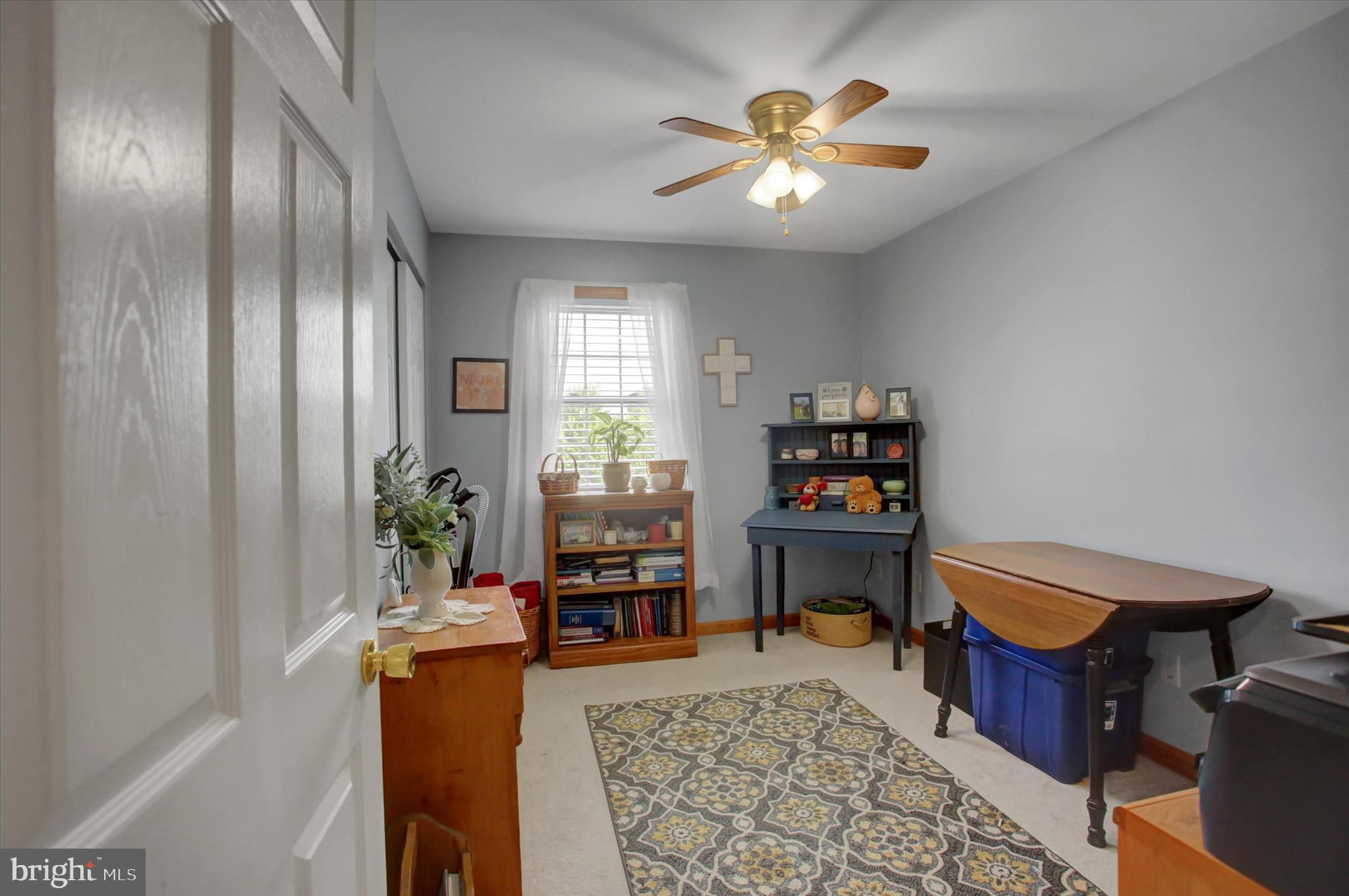 10482 Mapleton Road Shippensburg, PA 17257 - Photo 18 of 40 a bedroom with a bed and a chandelier