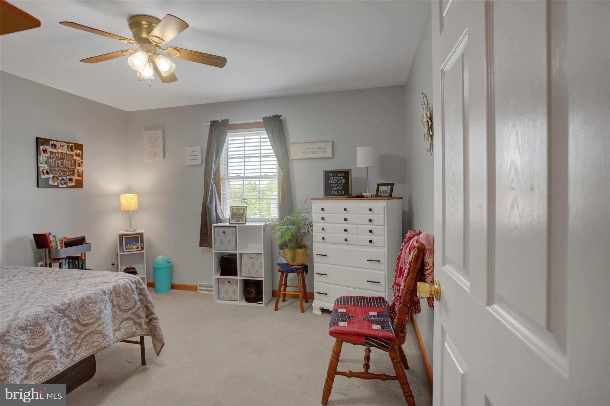 10482 Mapleton Road Shippensburg, PA 17257 - Photo 20 of 40 a bedroom with a bed and a chandelier