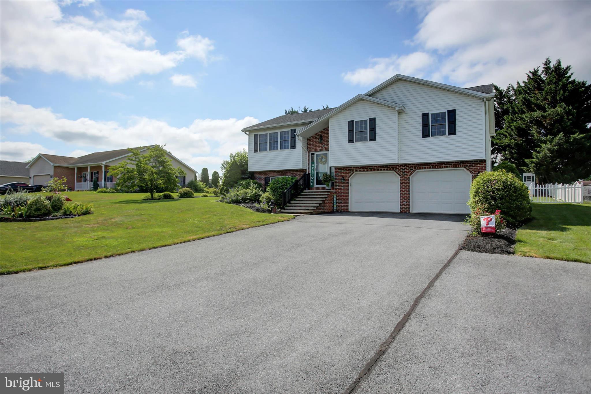 10482 Mapleton Road Shippensburg, PA 17257 - Photo 2 of 40 a front view of a house with a yard and garage