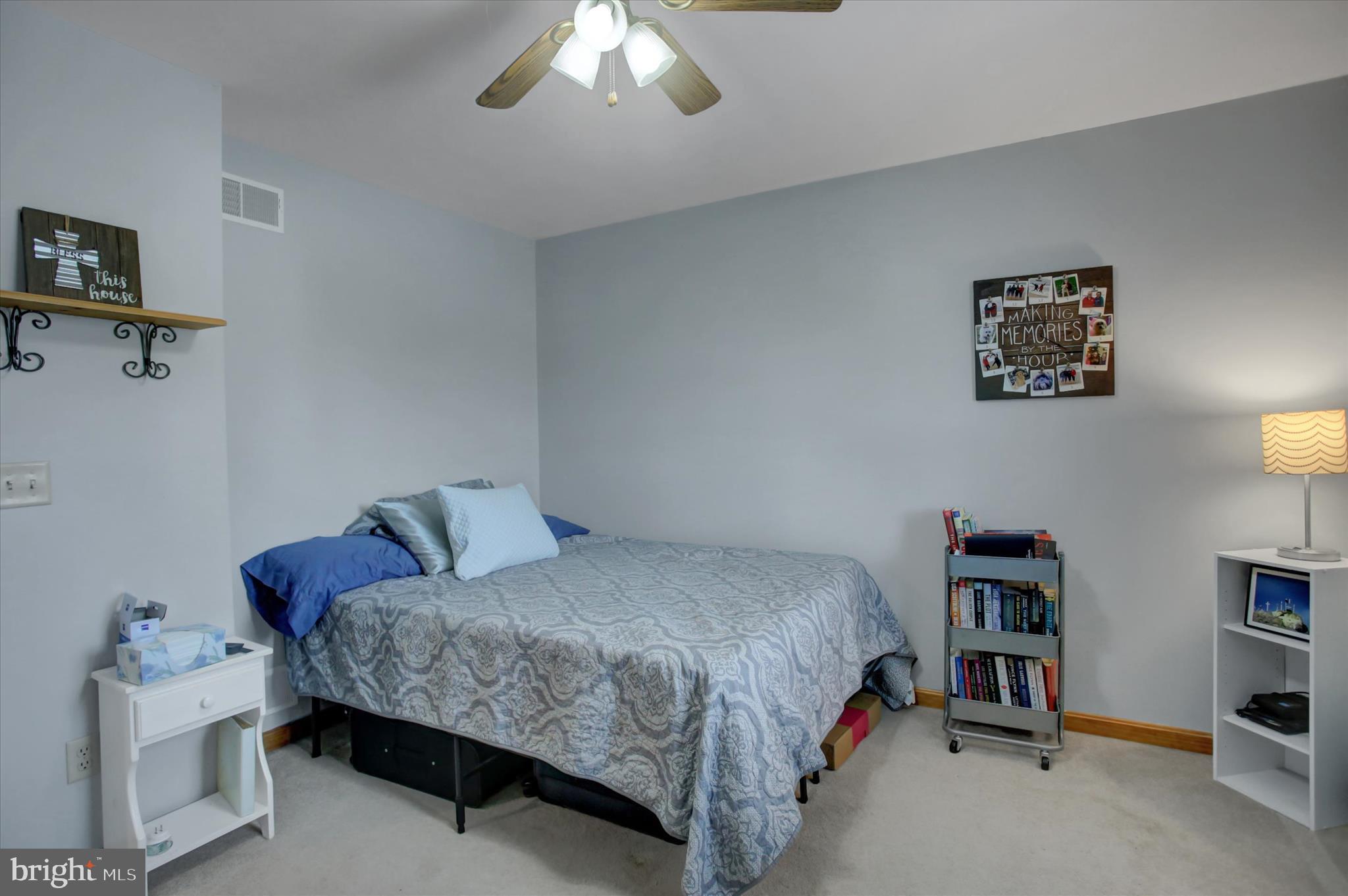10482 Mapleton Road Shippensburg, PA 17257 - Photo 21 of 40 a bedroom with a bed and a chandelier