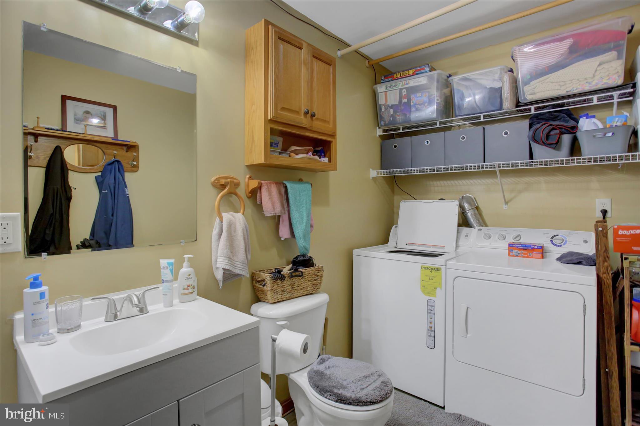 10482 Mapleton Road Shippensburg, PA 17257 - Photo 26 of 40 a bathroom with a sink and a washer dryer