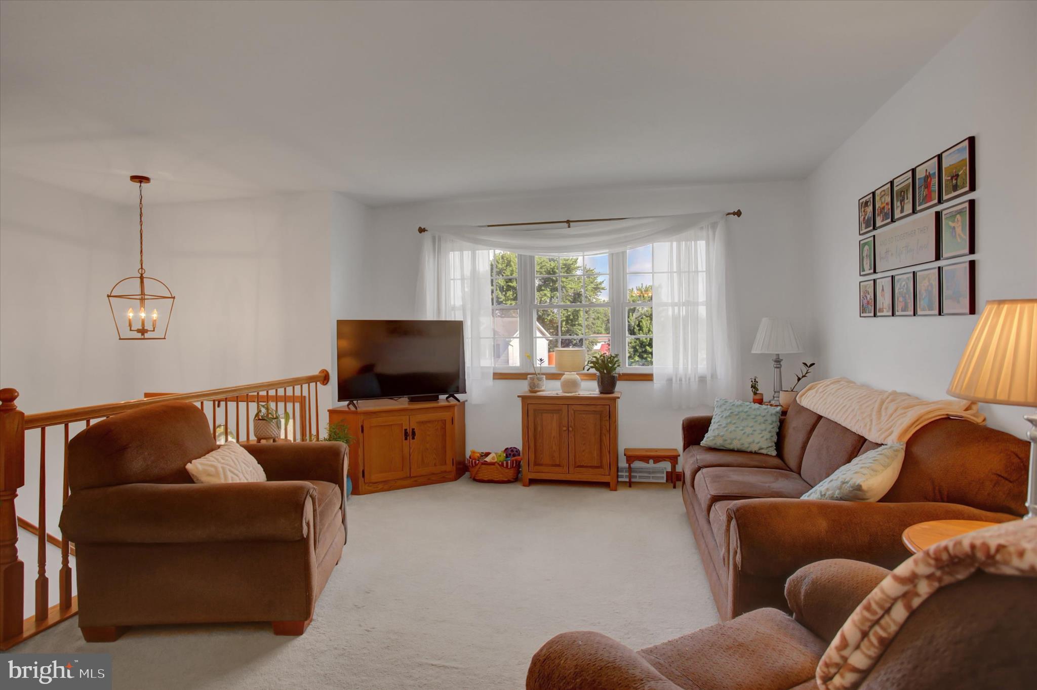10482 Mapleton Road Shippensburg, PA 17257 - Photo 9 of 40 a living room with furniture and a flat screen tv