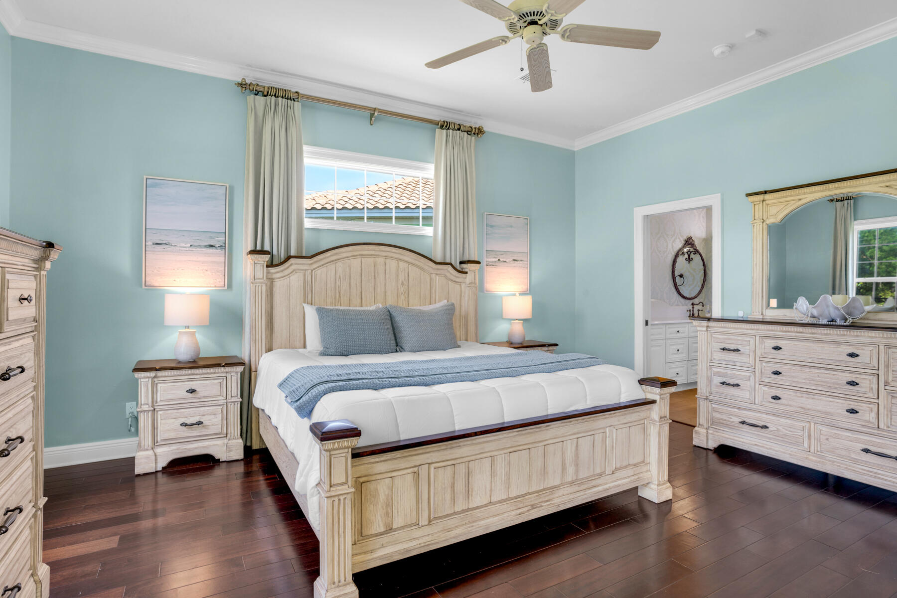 116 Tranquility Lane Destin, FL 32541 - Photo 14 of 27 a bedroom with a bed a chandelier and dresser