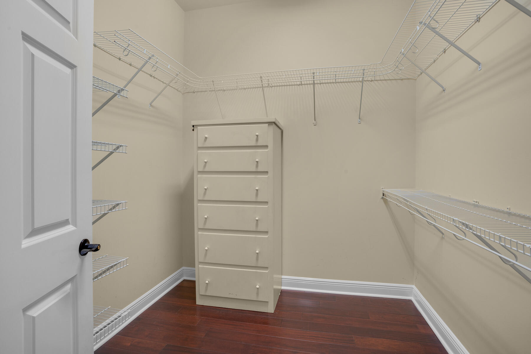 116 Tranquility Lane Destin, FL 32541 - Photo 18 of 27 a view of walk in closet with empty racks