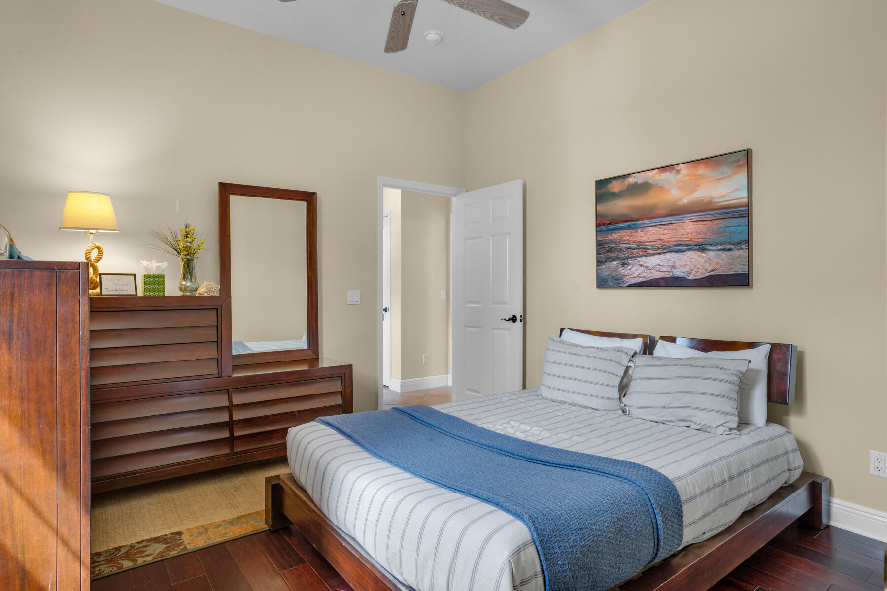 116 Tranquility Lane Destin, FL 32541 - Photo 20 of 27 a bedroom with a bed and a chandelier