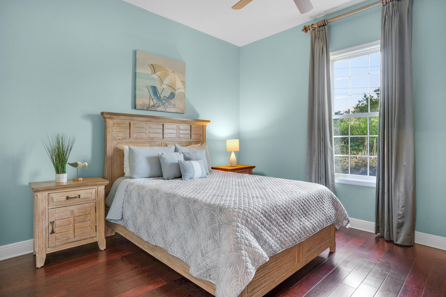 116 Tranquility Lane Destin, FL 32541 - Photo 22 of 27 a bedroom with a bed and wooden floor
