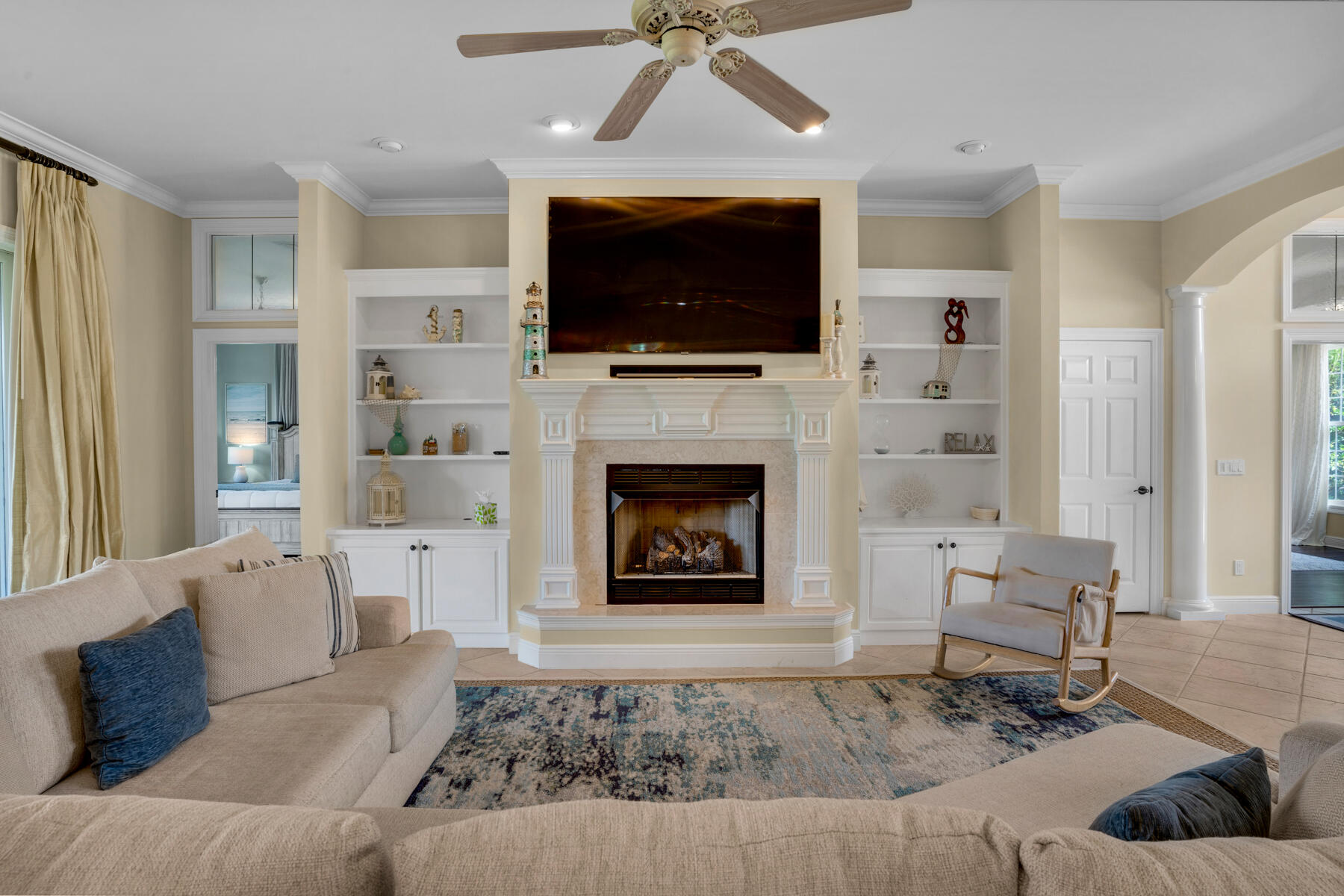 116 Tranquility Lane Destin, FL 32541 - Photo 3 of 27 a living room with furniture a flat screen tv and a fireplace