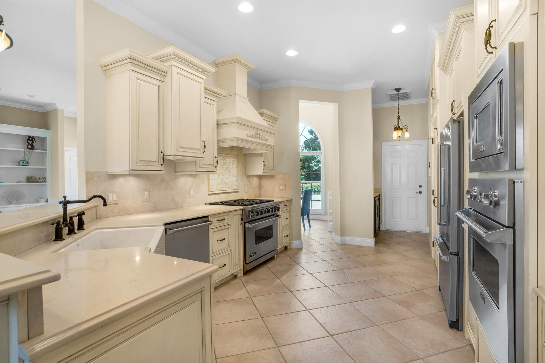 116 Tranquility Lane Destin, FL 32541 - Photo 5 of 27 a kitchen with stainless steel appliances a sink and a refrigerator