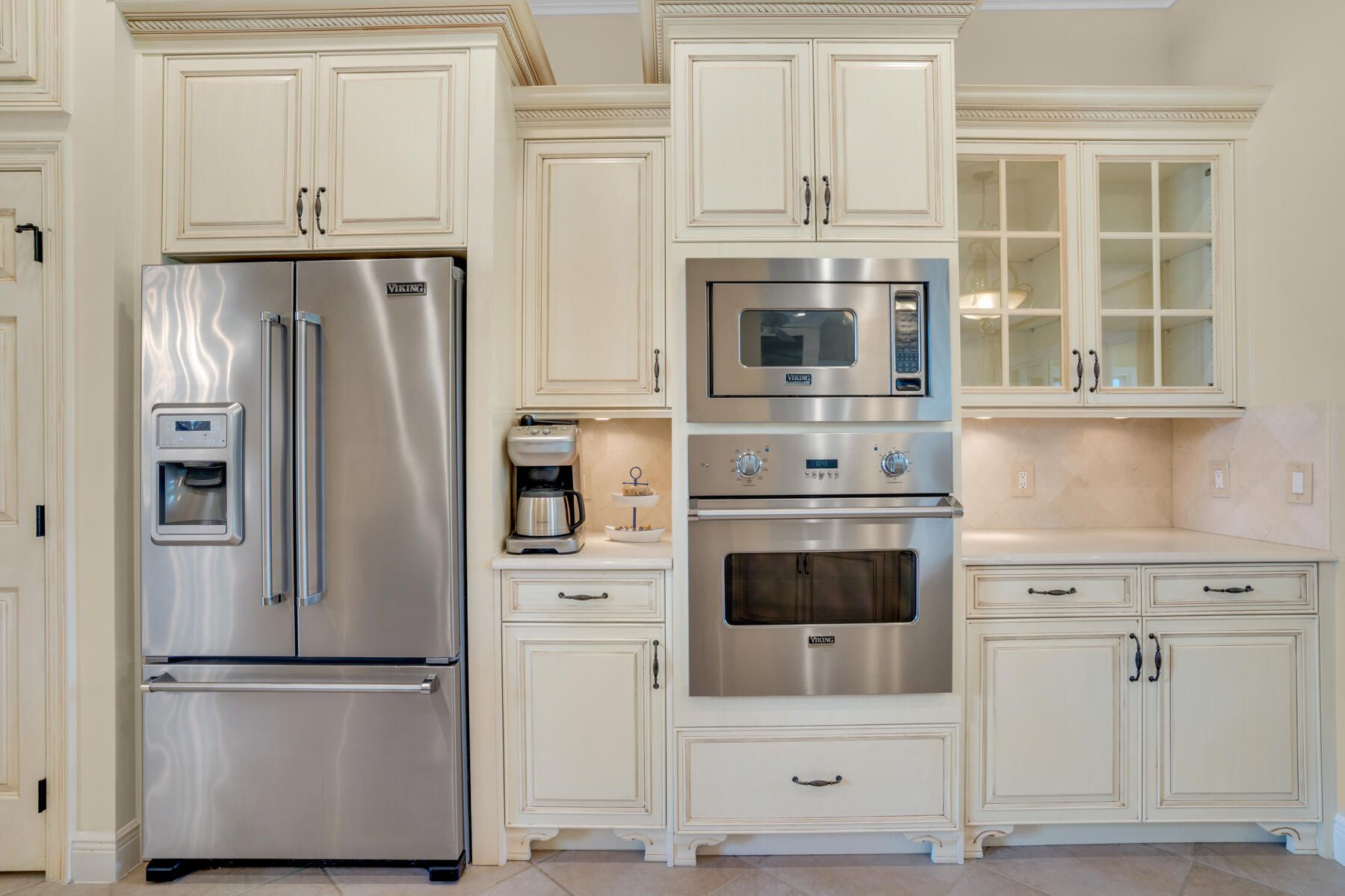 116 Tranquility Lane Destin, FL 32541 - Photo 6 of 27 a kitchen with stainless steel appliances white cabinets and a refrigerator
