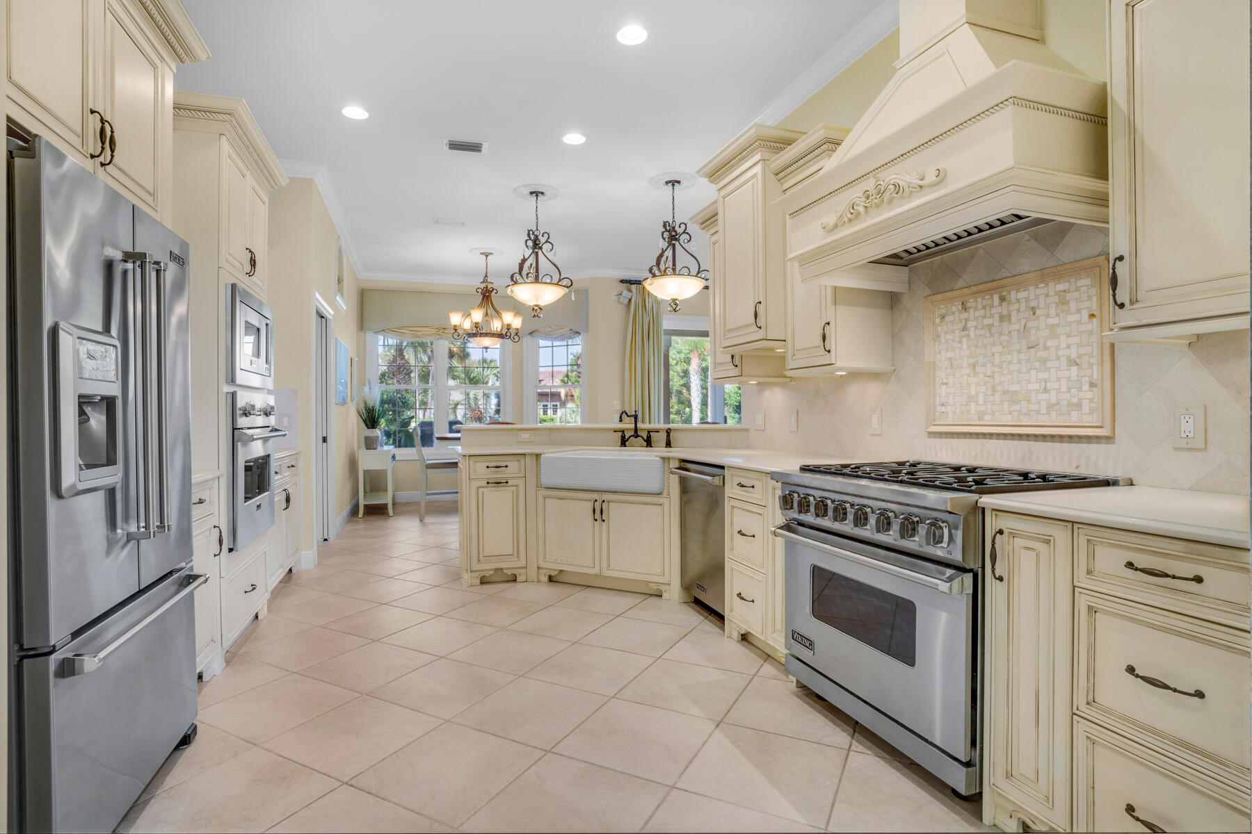 116 Tranquility Lane Destin, FL 32541 - Photo 7 of 27 a kitchen with stainless steel appliances a stove a sink and a refrigerator