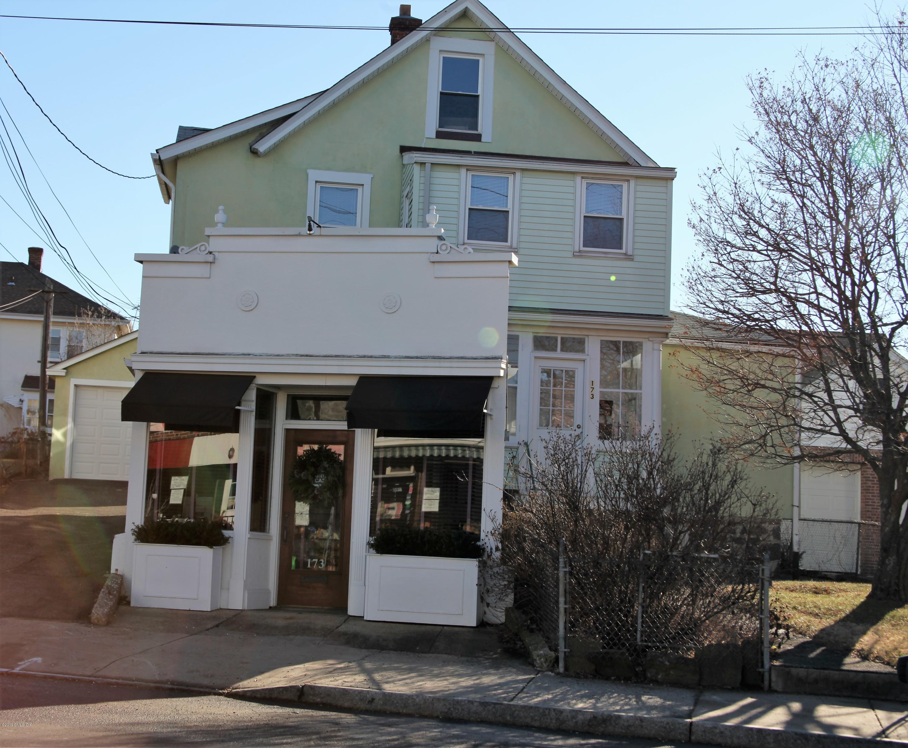 a front view of a house with parking