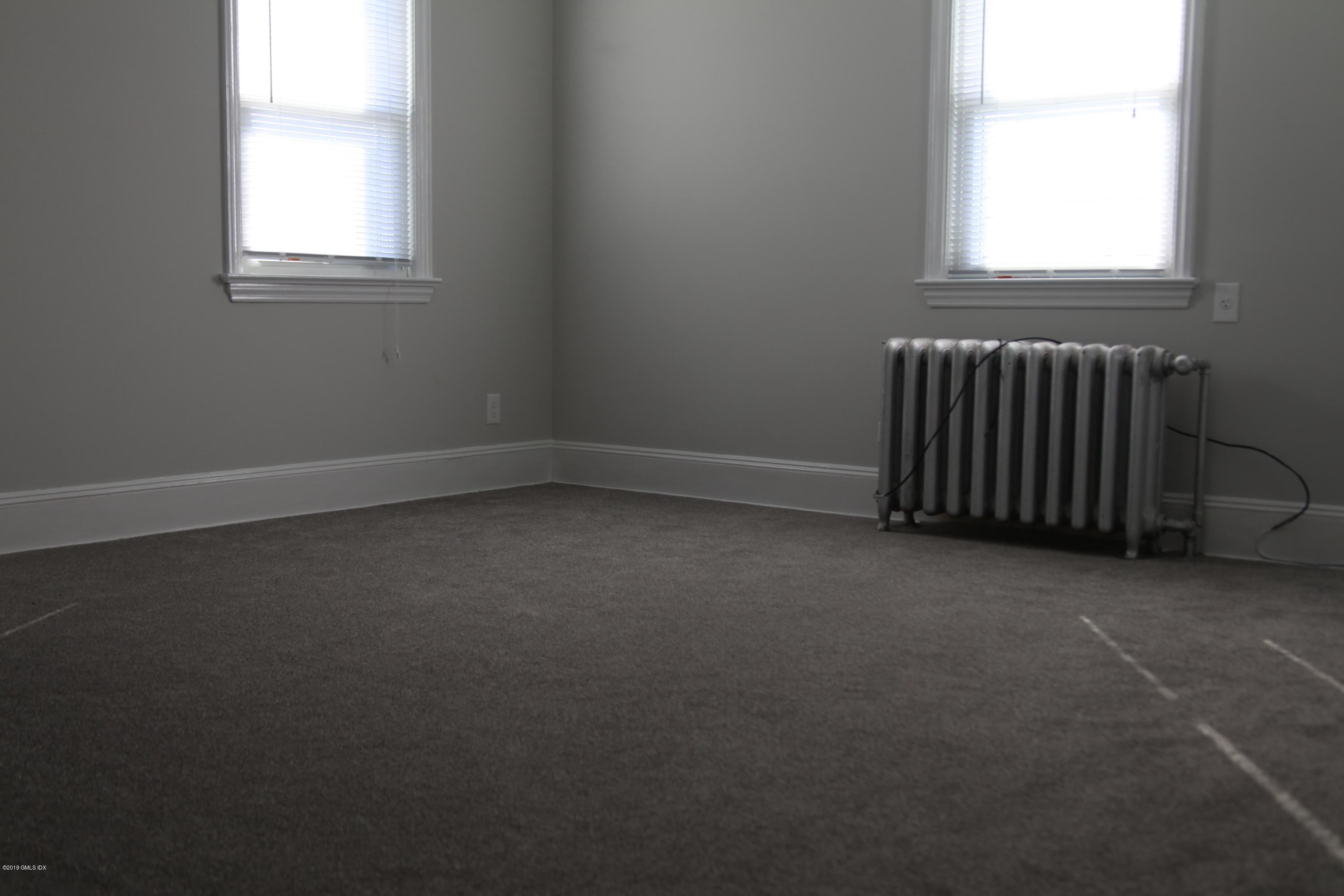 173 Hamilton Avenue Greenwich, CT 06830 - Photo 12 of 12 an empty room with a window