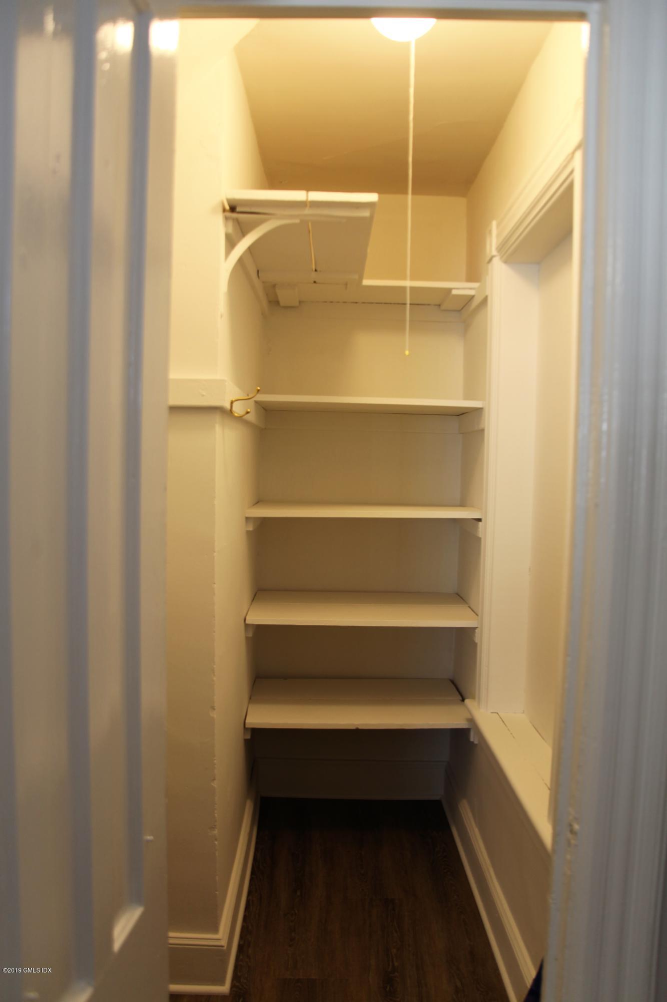 173 Hamilton Avenue Greenwich, CT 06830 - Photo 5 of 12 a storage room with empty racks