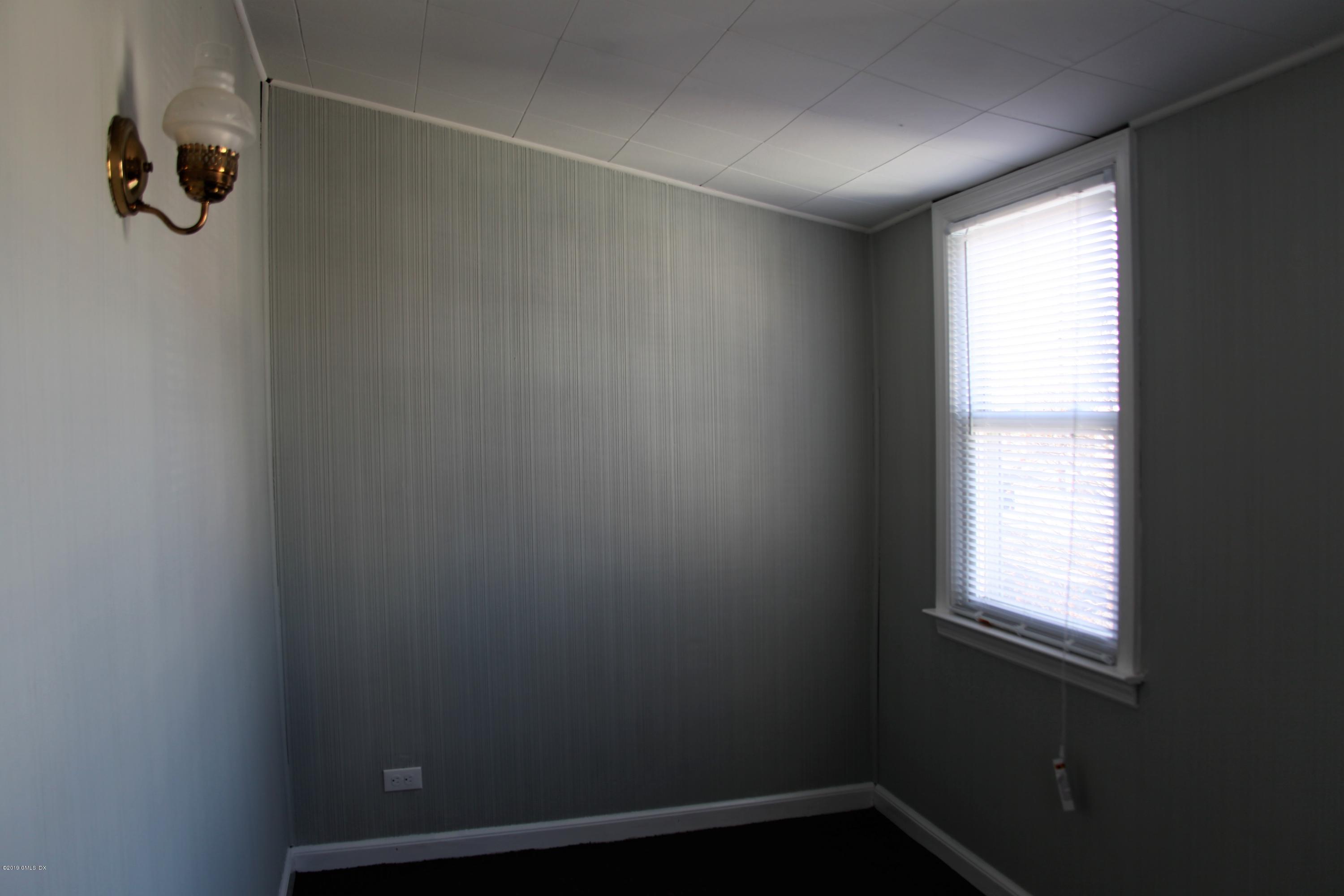 173 Hamilton Avenue Greenwich, CT 06830 - Photo 6 of 12 a view of a small space with window and gate