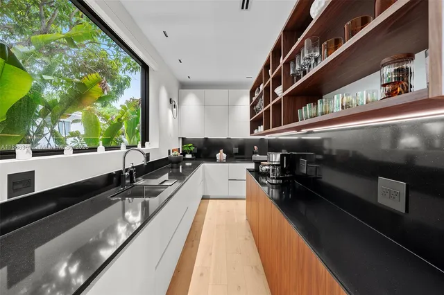 a living room filled with furniture and a potted plant