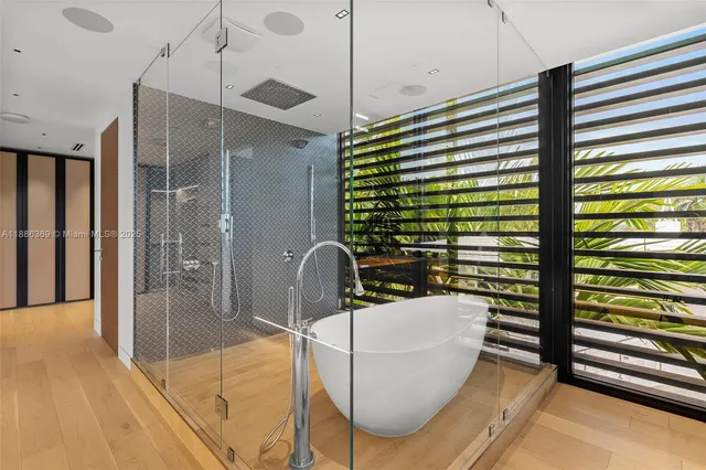 a bedroom with a bed lamp and a window