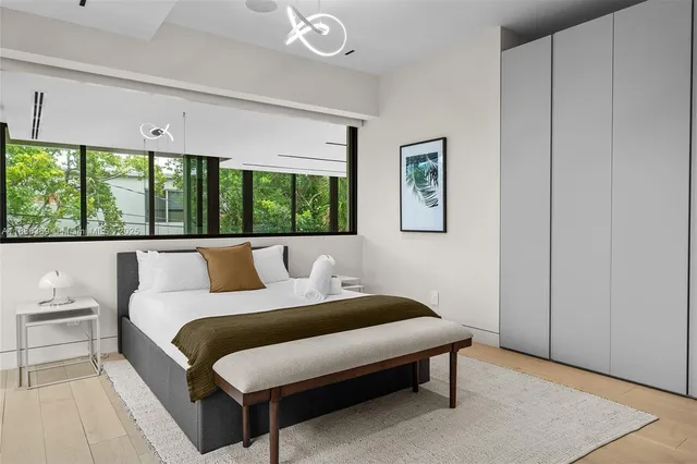 a view of a patio with table and chairs and potted plants