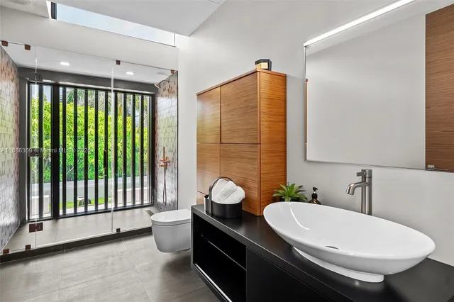 a view of a terrace with couches and city view