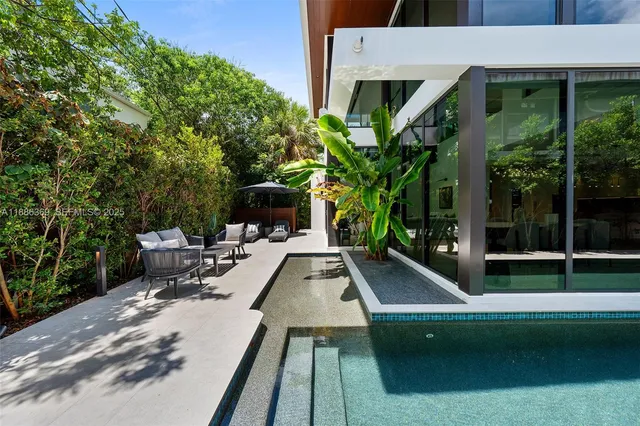 a view of living room with furniture and flat screen tv