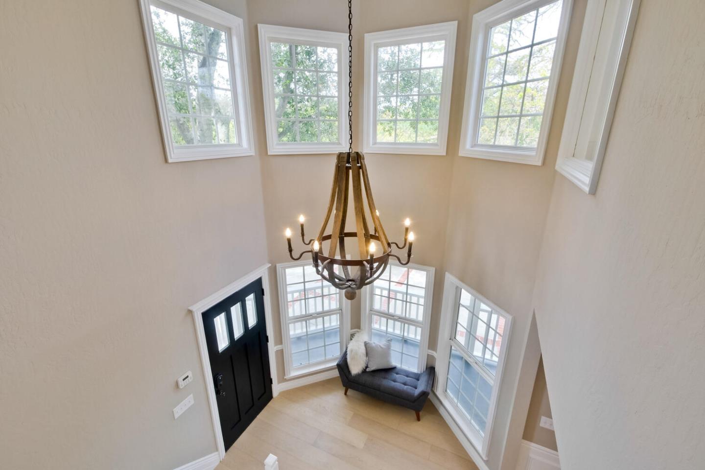 105 Terrace Road Walnut Creek, CA 94597 - Photo 13 of 47 a room with painting on the wall and a window