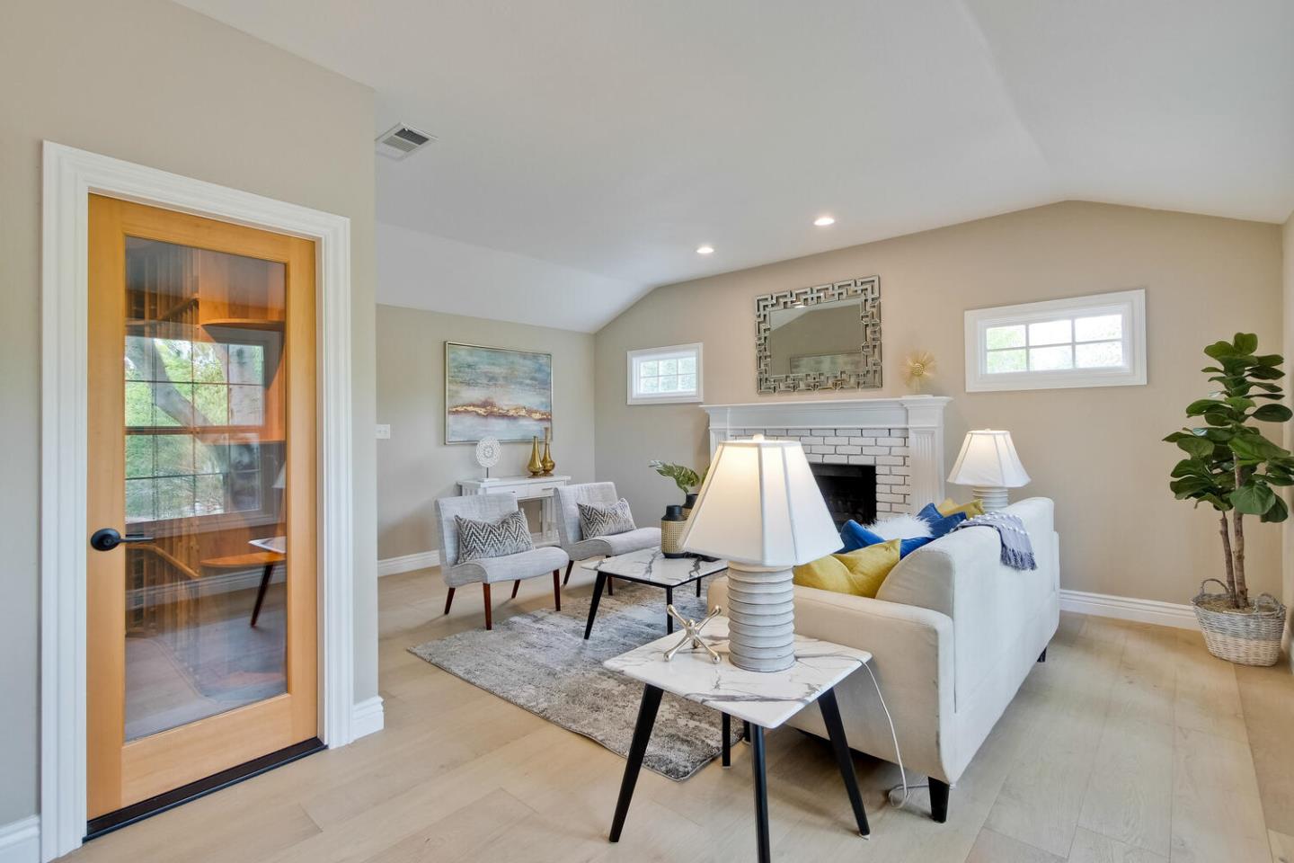 105 Terrace Road Walnut Creek, CA 94597 - Photo 19 of 47 a living room with furniture a fireplace and a potted plant