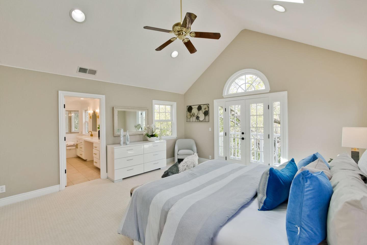 105 Terrace Road Walnut Creek, CA 94597 - Photo 25 of 47 a bedroom with a bed and a chandelier