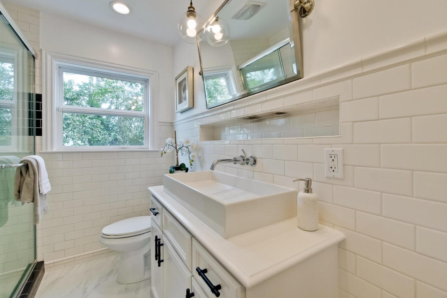 105 Terrace Road Walnut Creek, CA 94597 - Photo 37 of 47 a bathroom with a sink a toilet and a mirror