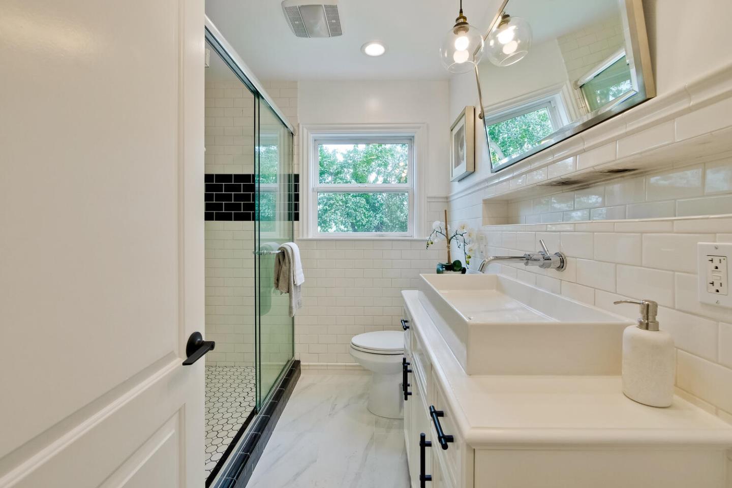 105 Terrace Road Walnut Creek, CA 94597 - Photo 38 of 47 a bathroom with a sink a toilet a mirror and shower