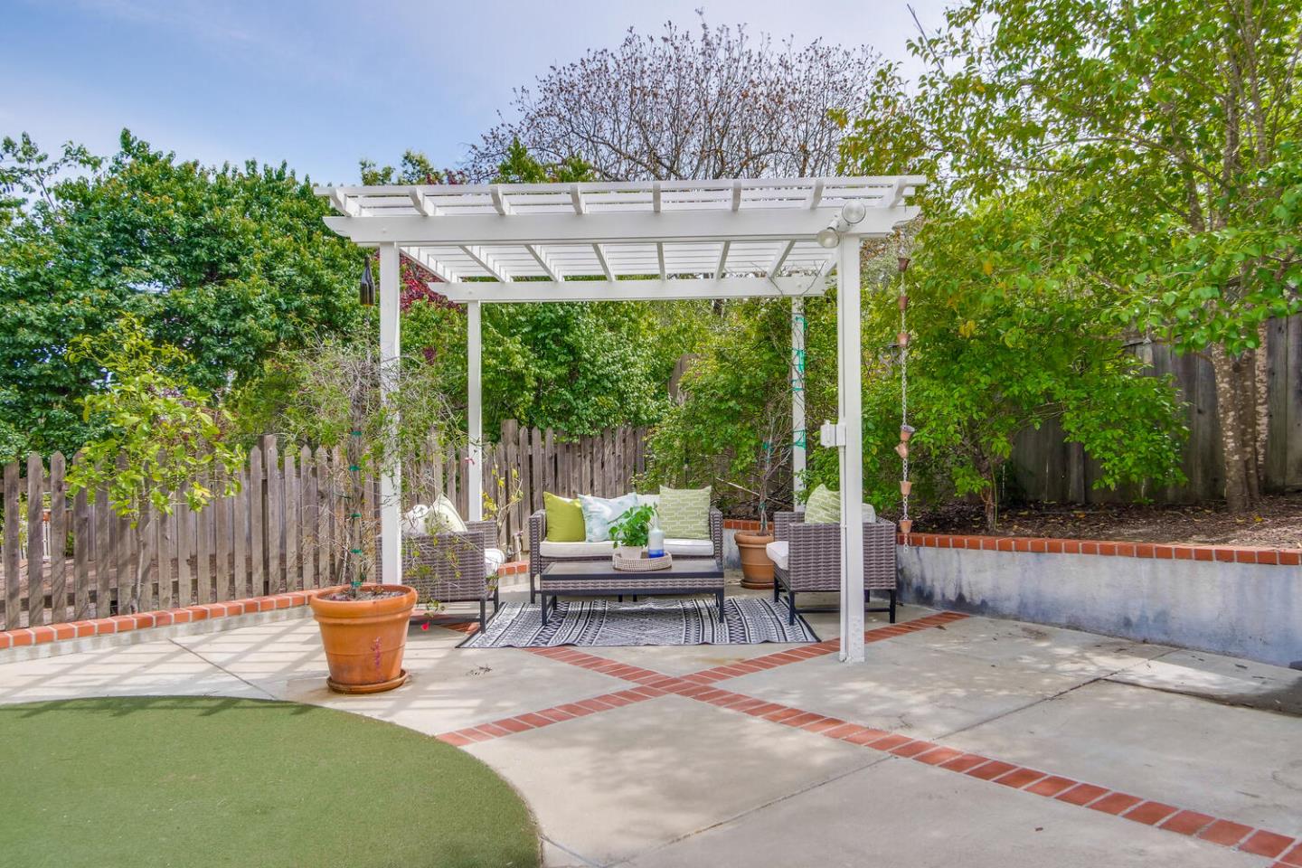 105 Terrace Road Walnut Creek, CA 94597 - Photo 46 of 47 a view of a patio with a table chairs and a backyard
