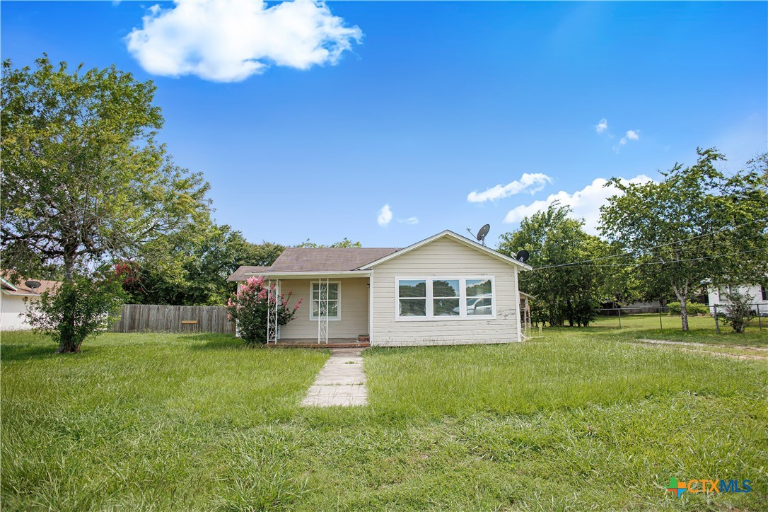 704 Maple Street Yoakum, TX 77995 - Photo 15 of 18 a view of a house with a yard