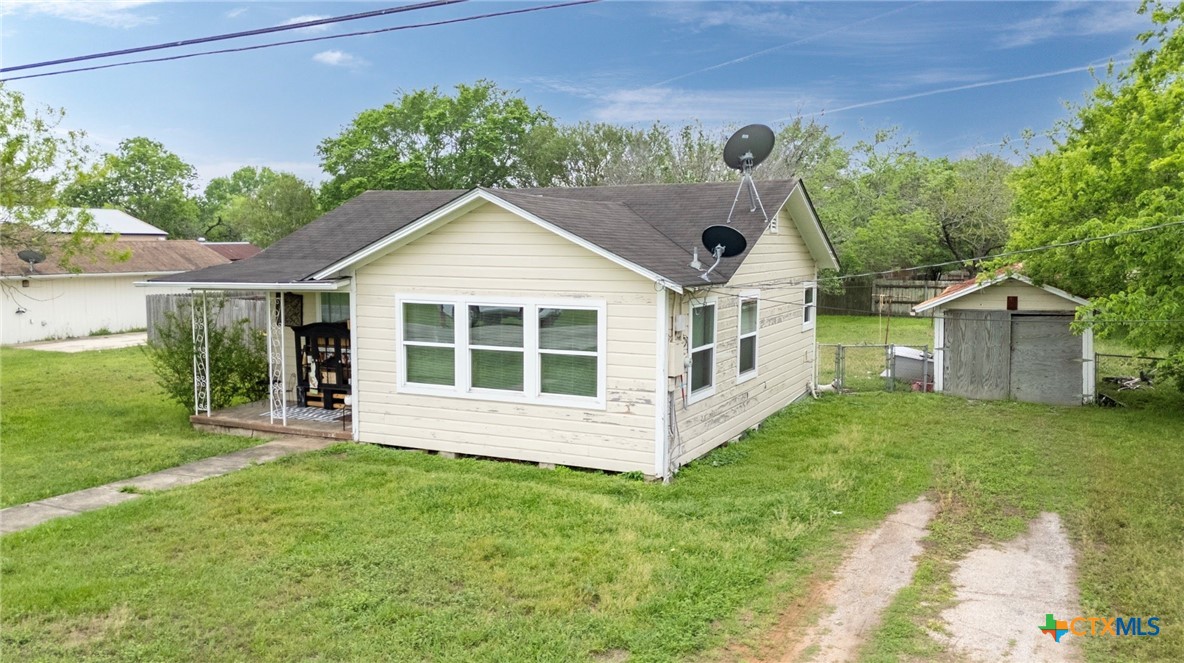 704 Maple Street Yoakum, TX 77995 - Photo 18 of 18 a front view of a house with a yard