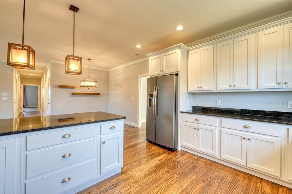 161 Loop Lane Blairsville, GA 30512 - Photo 11 of 67 a kitchen with granite countertop white cabinets and refrigerator