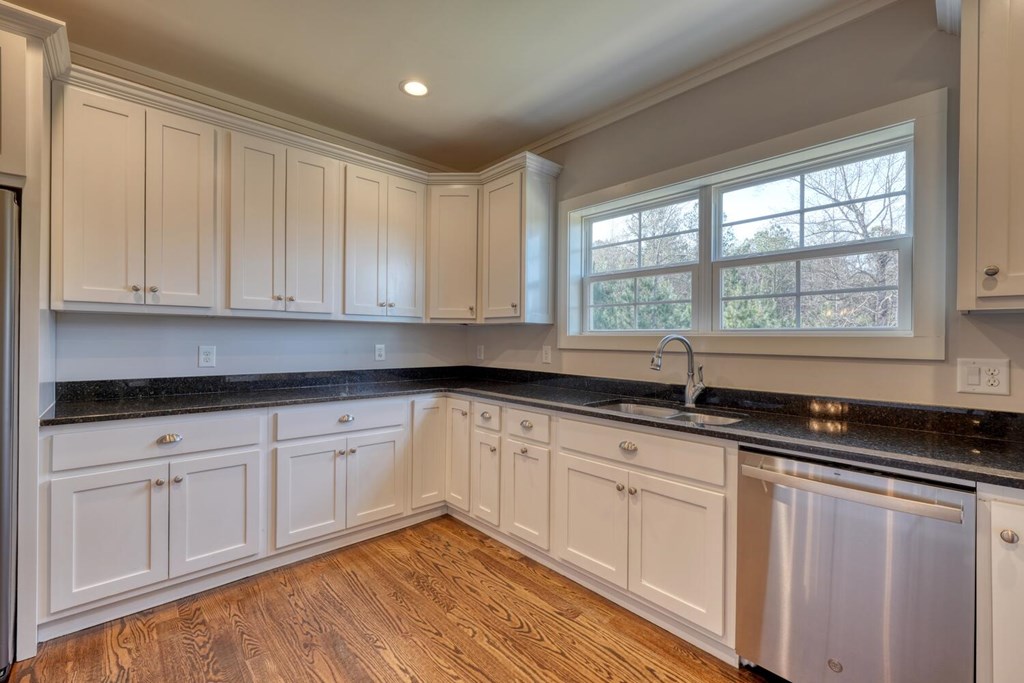 161 Loop Lane Blairsville, GA 30512 - Photo 12 of 67 a kitchen with granite countertop white cabinets sink and window