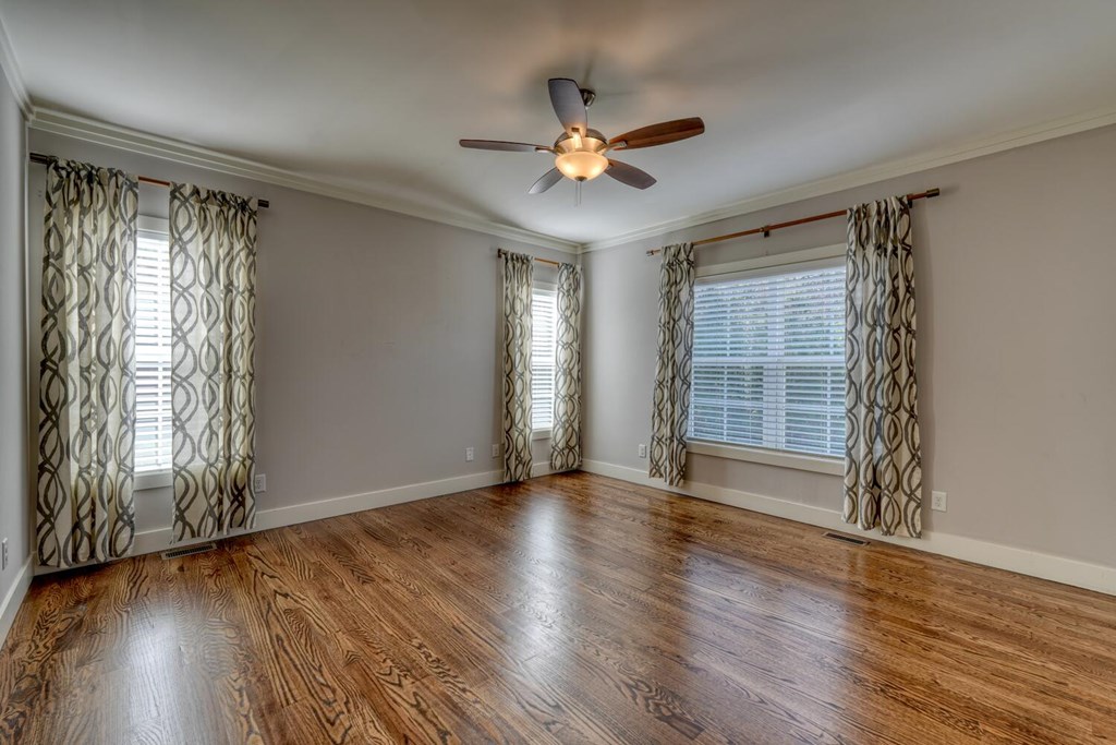 161 Loop Lane Blairsville, GA 30512 - Photo 13 of 67 a view of an empty room with wooden floor and a window