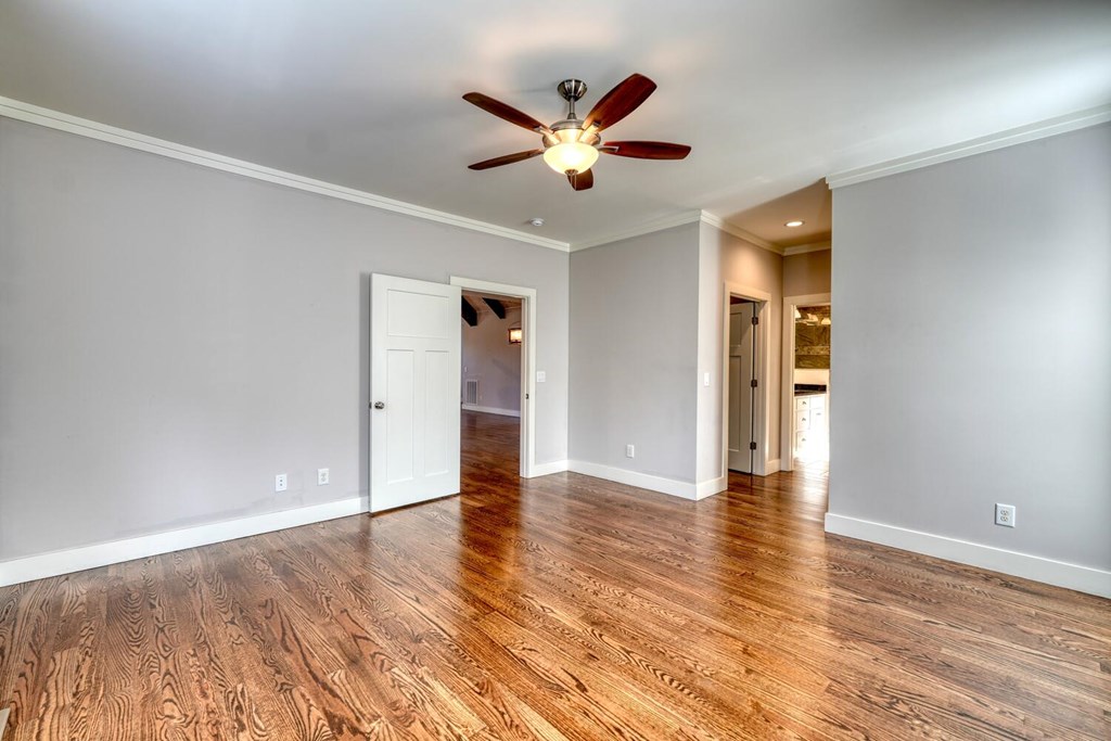 161 Loop Lane Blairsville, GA 30512 - Photo 15 of 67 an empty room with wooden floor and ceiling fan
