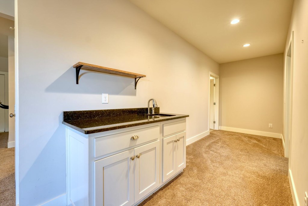 161 Loop Lane Blairsville, GA 30512 - Photo 36 of 67 a kitchen with granite countertop a sink and cabinets