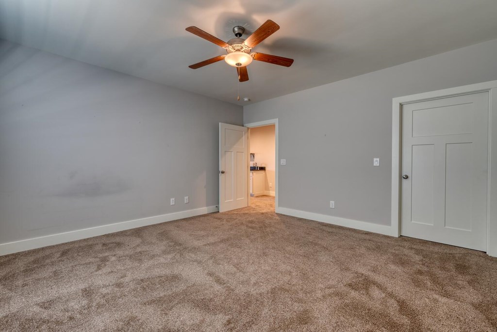 161 Loop Lane Blairsville, GA 30512 - Photo 40 of 67 an empty room with closet and a ceiling fan