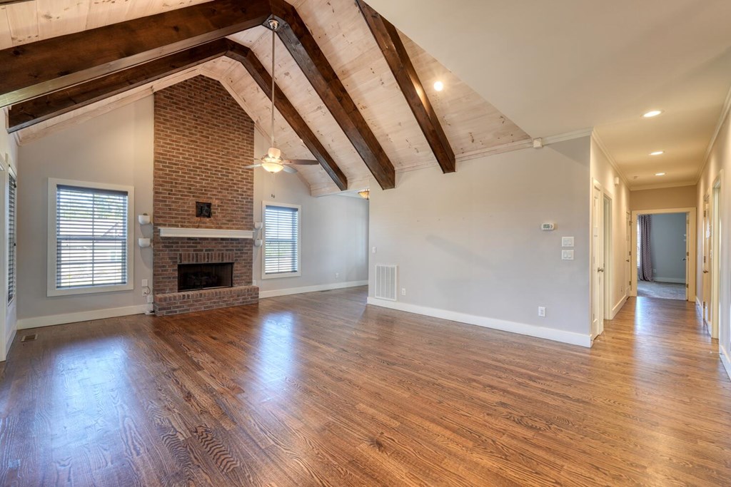 161 Loop Lane Blairsville, GA 30512 - Photo 6 of 67 a view of a livingroom with wooden floor and a fireplace