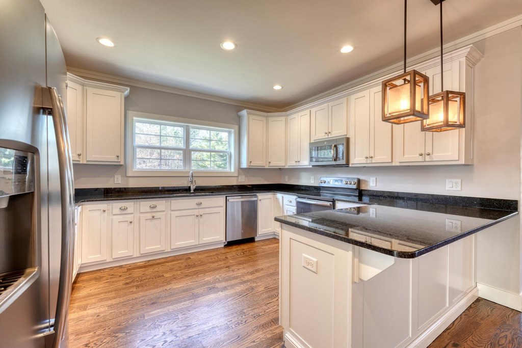 161 Loop Lane Blairsville, GA 30512 - Photo 9 of 67 a kitchen with stainless steel appliances granite countertop a sink a stove a refrigerator a center island and cabinets