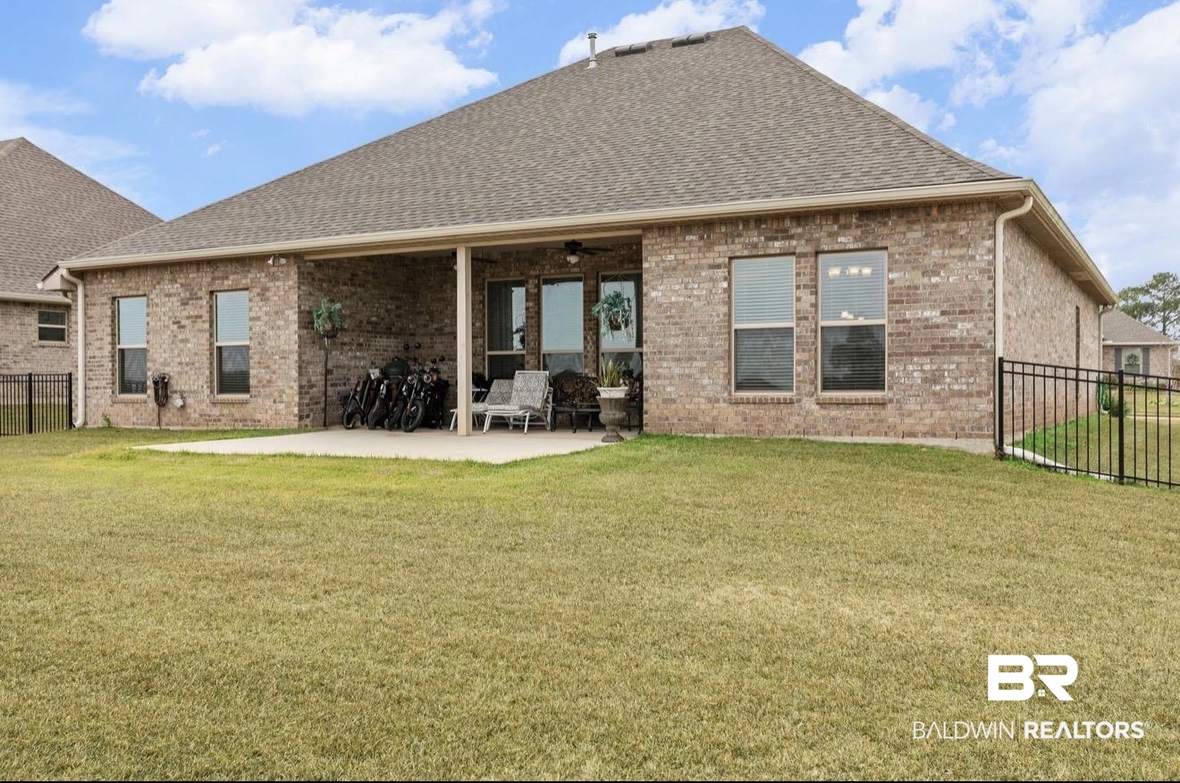 10126 Chipper Lane Foley, AL 36535 - Photo 26 of 30 Rear view of property with a fenced backyard, brick siding, a patio, and ceiling fan