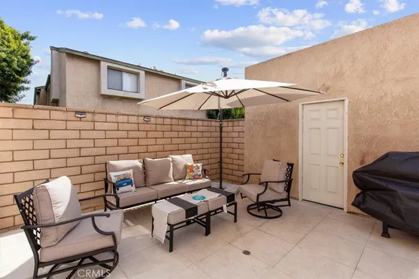 a bedroom with a bed lamp and a dresser